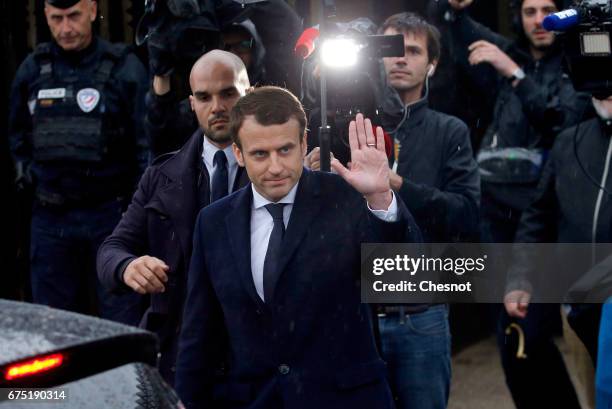President of the political movement 'En Marche!' and candidate for the French presidential election Emmanuel Macron waves as he leaves the "Memorial...