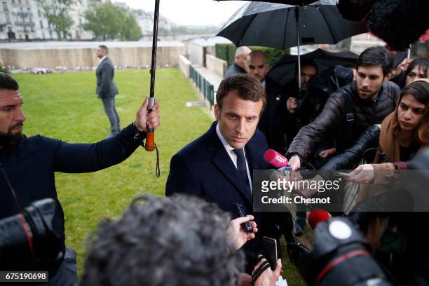 President of the political movement 'En Marche!' and candidate for the French presidential election Emmanuel Macron makes a statement after his visit...