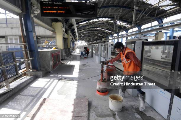 Construction work going on at the new Botanical Garden metro stations on April 11, 2017 in Noida, India. The new station will connect the existing...