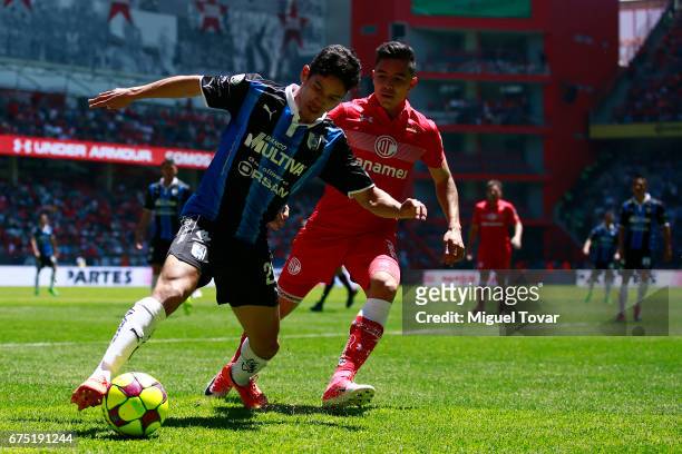 Efrain Velarde of Toluca fights for the ball with Jaime Gomez of Queretaro during the 16th round match between Toluca and Queretaro as part of the...
