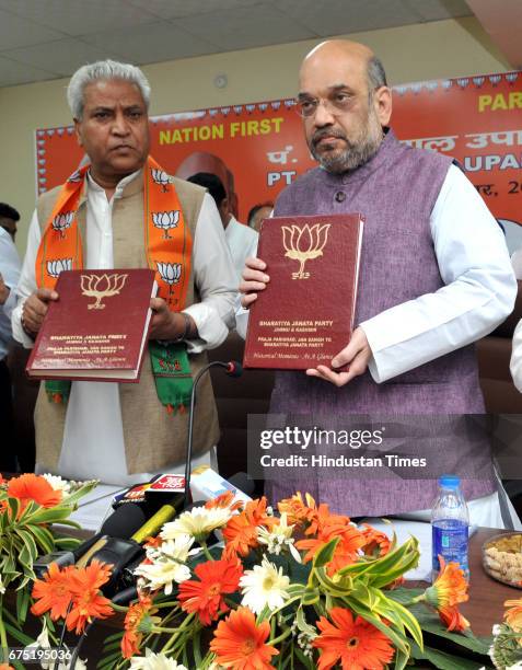 National President Amit Shah releasing BJP historical moments book on the inauguration of Library at BJP office during his two day visit to Jammu on...