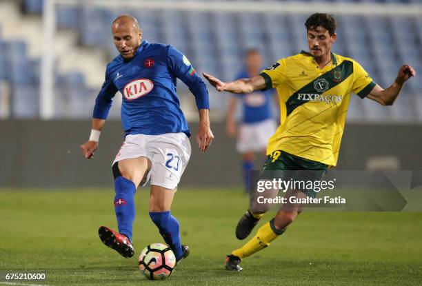 Belenenses's midfielder Hassan Yebda from Argelia with Pacos Ferreira's forward Vasco Rocha from Portugal in action during the Primeira Liga match...