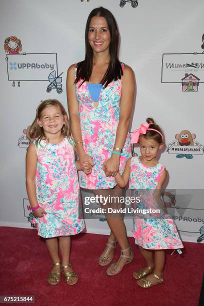 Erin Kristine Ludwig and daughters Mia Loren Ziering and Penna Mae Ziering attend the WE ALL PLAY FUNdraiser hosted by the Zimmer Children's Museum...