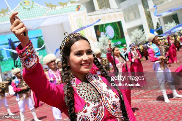 Dancers perform during the ceremony of Annual Turkmen Racing Horse Festival at Equestrian Sports Complex and Hippodrome in Ashgabat, Turkmenistan on...