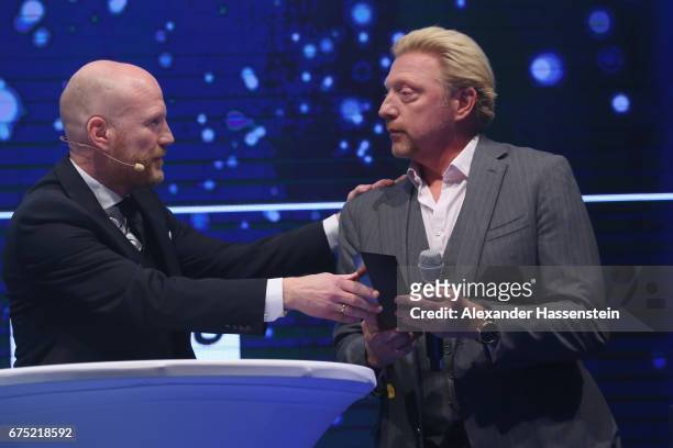 Boris Becker receives the Iphitos Award 2017 from Matthias Sammer at the Players Night of the 102. BMW Open by FWU at Iphitos tennis club on April...