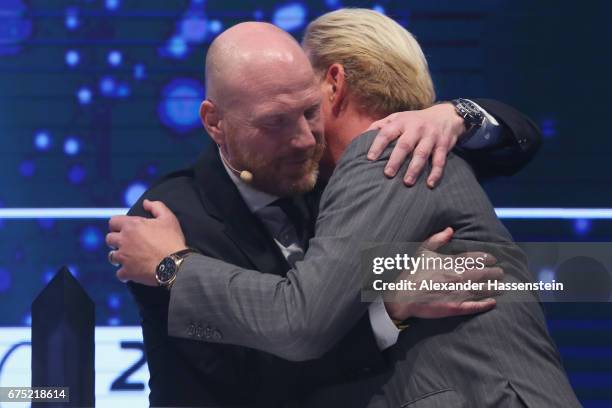 Boris Becker receives the Iphitos Award 2017 from Matthias Sammer at the Players Night of the 102. BMW Open by FWU at Iphitos tennis club on April...