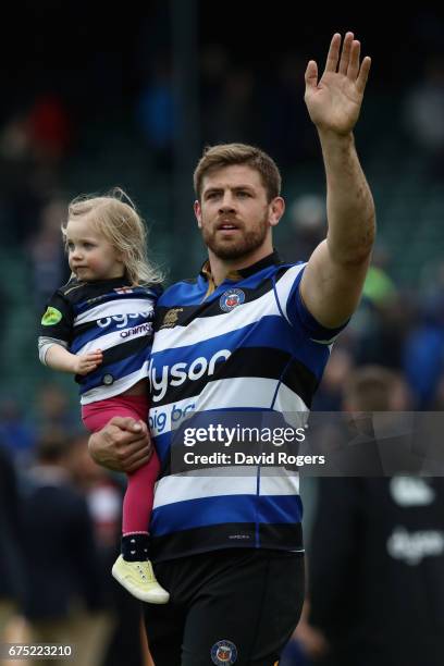 Dave Attwood carries his daughter on the Bath lap of honour during the Aviva Premiership match between Bath and Gloucester at the Recreation Ground...