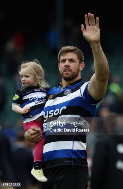 Dave Attwood carries his daughter on the Bath lap of honour during the Aviva Premiership match between Bath and Gloucester at the Recreation Ground...