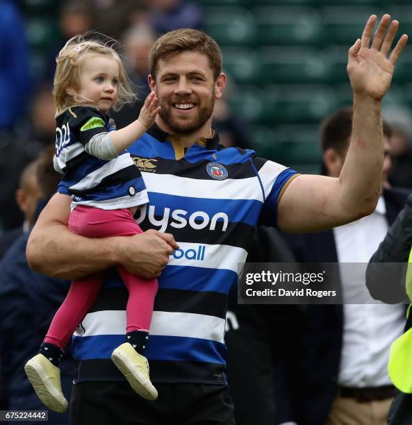 Dave Attwood carries his daughter on the Bath lap of honour during the Aviva Premiership match between Bath and Gloucester at the Recreation Ground...