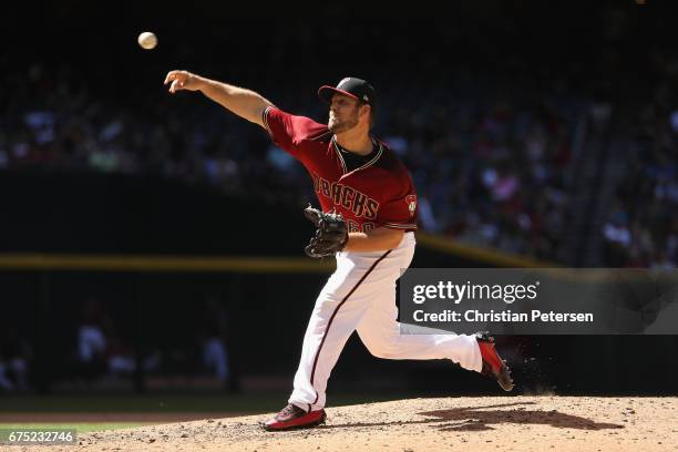 Relief pitcher J.J. Hoover of the Arizona Diamondbacks pitches against the Colorado Rockies during the seventh inning of the MLB game at Chase Field...