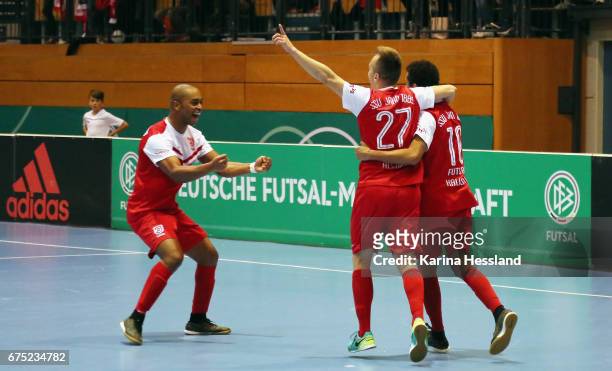 Marcus Vinicius Da Silva Lima, Luiz Gustavo Perotto Correa and Halison Goncalves of Jahn Regensburg celebrate the goal during the Deutsche Futsal...