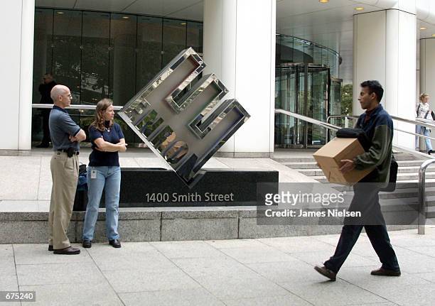 Enron employees leave the company's headquarters after being laid off December 3,2001 in Houston, Texas. Enron filed for Chapter 11 protection and...