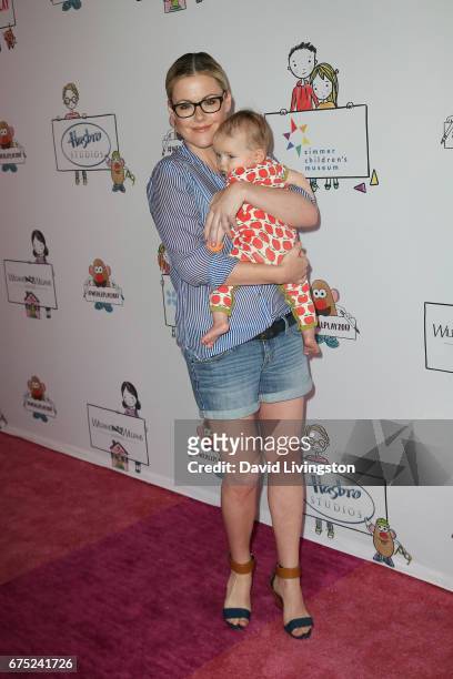 Actress Kathleen Robertson and William Robert Cowles attend the WE ALL PLAY FUNdraiser hosted by the Zimmer Children's Museum at the Zimmer...