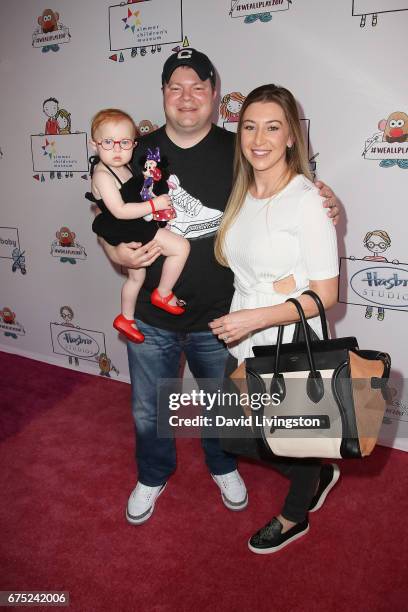 Madden Jae Caparulo, John Caparulo and Jamie Marie Caparulo attend the WE ALL PLAY FUNdraiser hosted by the Zimmer Children's Museum at the Zimmer...