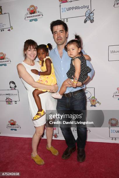 Rosemarie DeWitt, Gracie James Livingston, Ron Livingston and Esperanza Mae Livingston attend the WE ALL PLAY FUNdraiser hosted by the Zimmer...