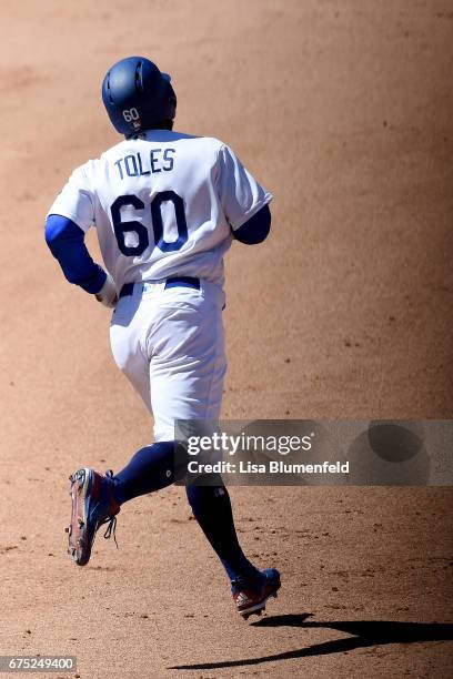 Andrew Toles of the Los Angeles Dodgers runs the bases after hitting a three run homerun in the sixth inning against the Philadelphia Phillies at...