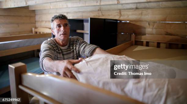Peja, Kosovo The innkeeper of a guest house arranges beds on March 30, 2017 in Peja, Kosovo.