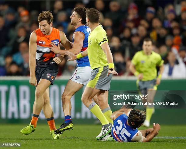 Tom Liberatore of the Bulldogsremonstrates with Toby Greene of the Giants after he laid a late hit on Caleb Daniel of the Bulldogs during the 2017...