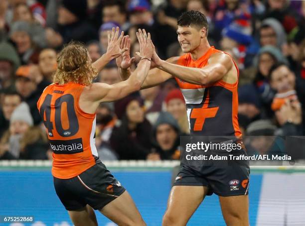 Jonathon Patton of the Giants 9right) celebrates a goal with Adam Kennedy of the Giants during the 2017 AFL round 06 match between the GWS Giants and...