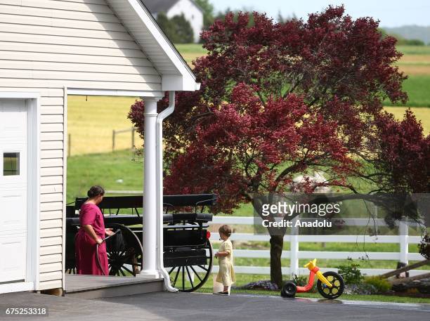 Amish women and a girl are seen in Central Pennsylvania, United States on April 30, 2017. Central Pennsylvania is home to an iconic set of plain...