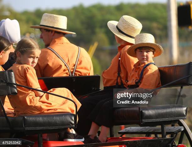 Amish children are seen on an amish horse in Central Pennsylvania, United States on April 30, 2017. Central Pennsylvania is home to an iconic set of...