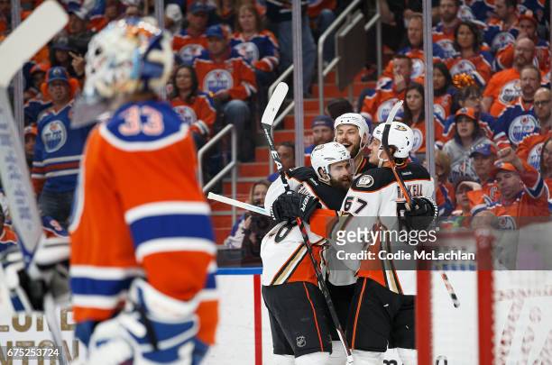 Patrick Eaves, Ryan Getzlaf and Rickard Rakell of the Anaheim Ducks celebrate a goal against goalie Cam Talbot of the Edmonton Oilers in Game Three...
