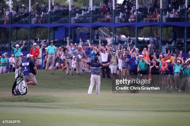 Kevin Kisner reacts to his eagle putt on the 18th hole during the final round of the Zurich Classic at TPC Louisiana on April 30, 2017 in Avondale,...
