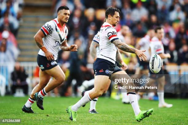 Mitchell Pearce of the Roosters kicks the ball forward during the round nine NRL match between the New Zealand Warriors and the Sydney Roosters at Mt...