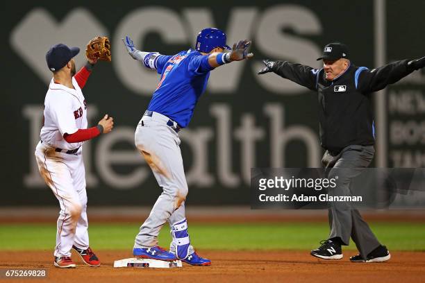 Albert Almora Jr. #5 of the Chicago Cubs slides safely into second base in the fourth inning of a game against the Boston Red Sox at Fenway Park on...