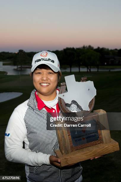 Haru Nomura of Japan poses with the champion's trophy following her playoff victory over Cristie Kerr in the final round of the Volunteers of America...