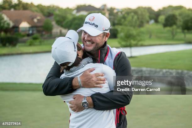Haru Nomura of Japan is embraced by her caddie Jason McDede, following her victory at the Volunteers of America North Texas Shootout at Las Colinas...