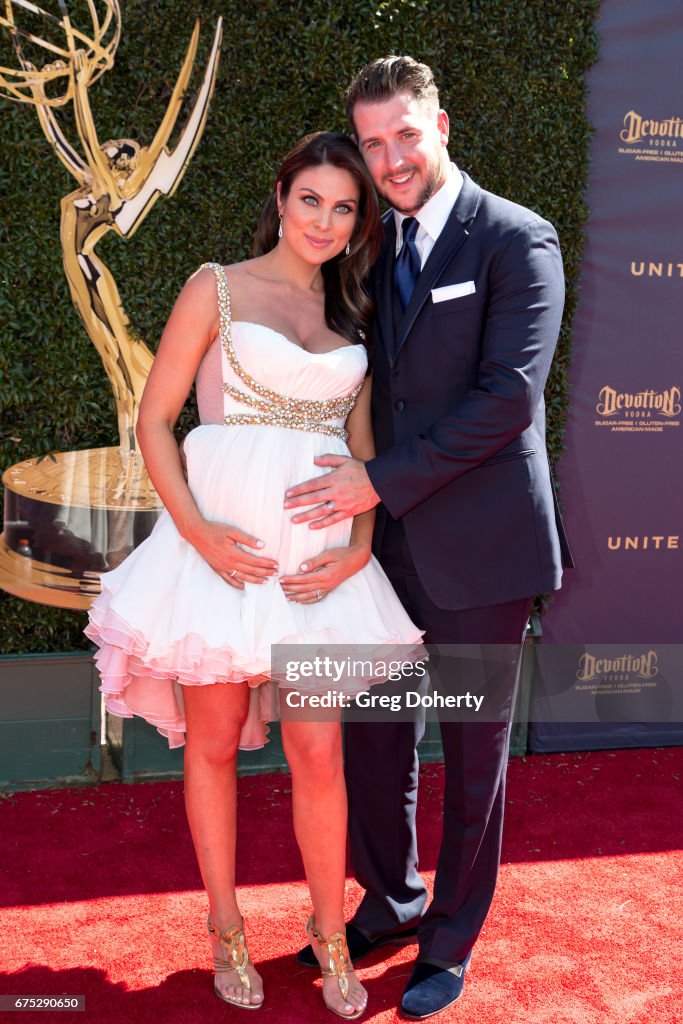 Actress Nadia Bjorlin and husband Grant Turnbull arrive at the 44th