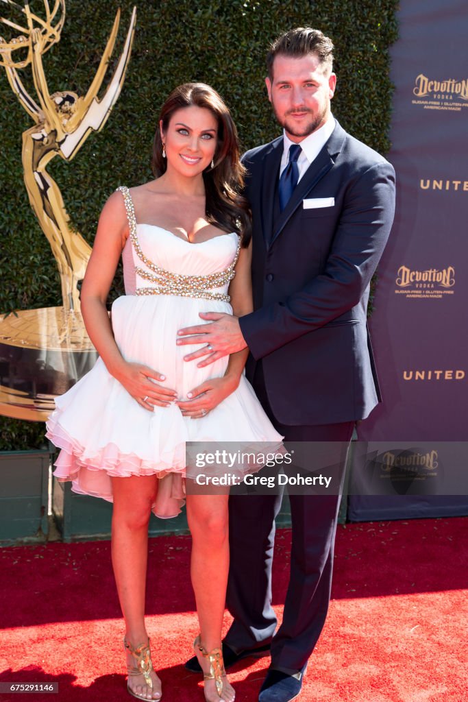 Actress Nadia Bjorlin and husband Grant Turnbull arrive at the 44th