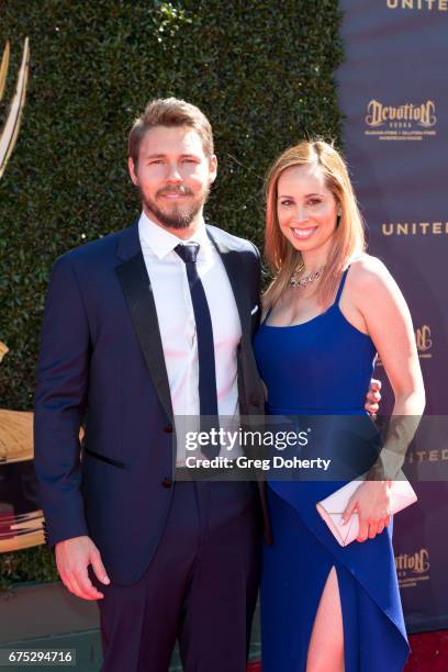 Actor Scott Clifton and wife Nicole Lampson arrives at the 44th Annual Daytime Emmy Awards at Pasadena Civic Auditorium on April 30, 2017 in...