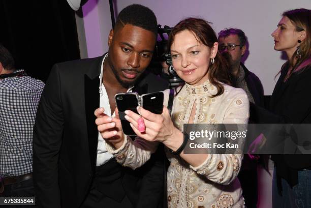 Jessy Matador poses for a selfie with a guest during Madame France 2017 Election Ceremonie at Espace MAS on April 30, 2017 in Paris, France.