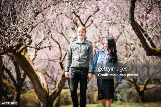 happy young couple to enjoy the tourism kyoto - カップル stock pictures, royalty-free photos & images