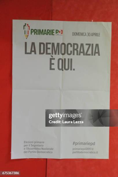 Poster is displayed while former Italian Prime Minister and PD secretary Matteo Renzi casts his vote for Democratic Party leadership primaries on...