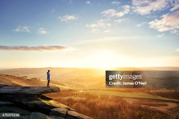 hiker looking out at sunset - european landscapes stock pictures, royalty-free photos & images