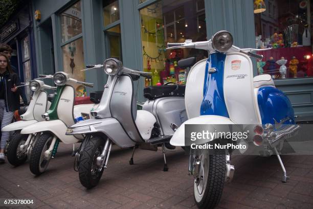 The Mods are pictured while gather with their scooters at Carnaby Street, London on April 30, 2017. Tens of Italian scooters appeared at the world...