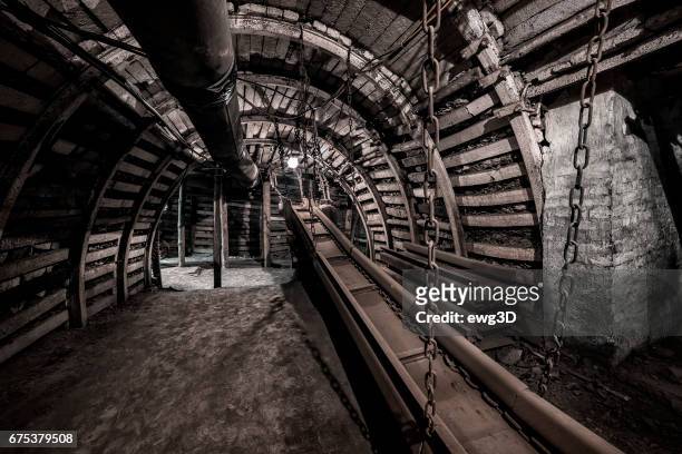 coal mine underground corridor with conveyor system - katowice stock pictures, royalty-free photos & images