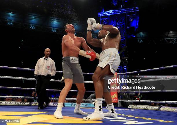 Anthony Joshua catches Wladimir Klitschko with a right hand upper cut in the 11th round of their IBF, WBA and IBO Heavyweight World Title bout at...