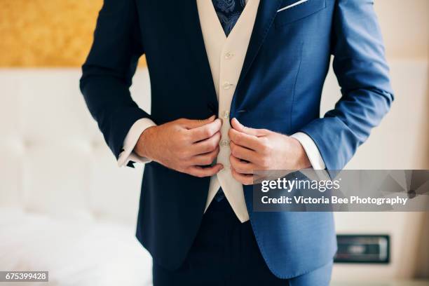 businessman or groom getting dressed - cufflink fotografías e imágenes de stock