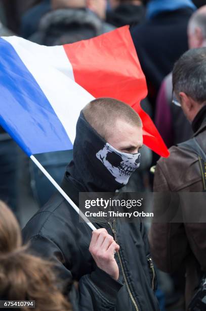 People listen as France's far-right political party Front National founder, Jean-Marie Le Pen honors Jeanne d'Arc "The Maid of Orléans" during a...