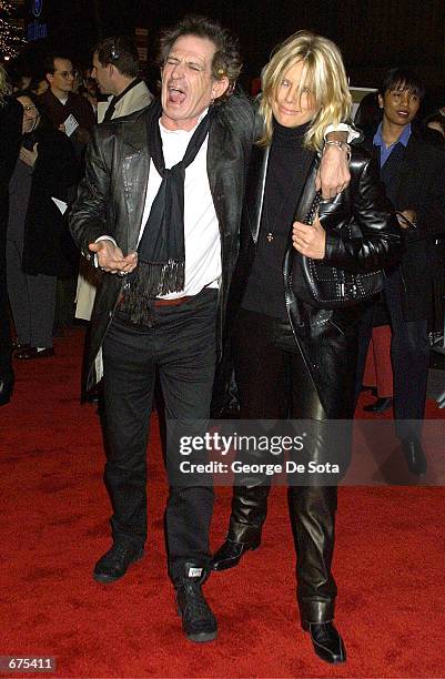Guitarist Keith Richards and his wife Patti Hansen attend the premiere of "Gosford Park" December 3, 2001 at the Ziefeld Theatre in New York City.