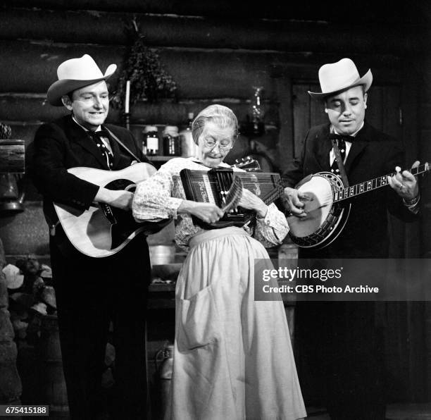 The Beverly Hillbillies The Beverly Hillbillies episode: Flatt, Clampett, and Scruggs. Pictured from left is guitar player Lester Flatt, Irene Ryan...