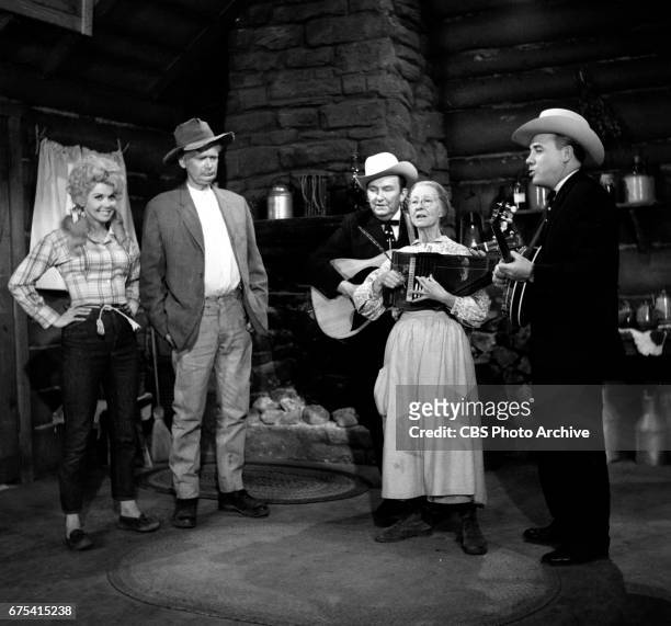 The Beverly Hillbillies The Beverly Hillbillies episode: Flatt, Clampett, and Scruggs. Pictured from left is Donna Douglas , Buddy Ebsen , guitar...