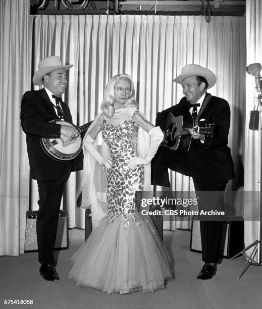 The Beverly Hillbillies The Beverly Hillbillies episode: Flatt, Clampett, and Scruggs. Pictured from left is banjo player Earl Scruggs, Irene Ryan...