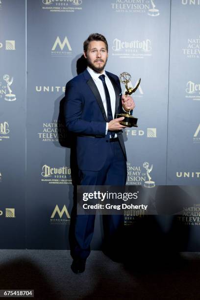 Actor Scott Clifton displays his Emmy Award at the 44th Annual Daytime Emmy Awards at Pasadena Civic Auditorium on April 30, 2017 in Pasadena,...