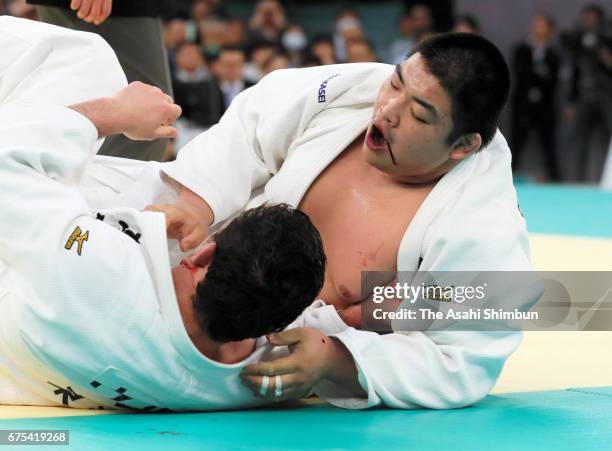 Takeshi Ojitani and Aaron Wolf compete in the final during the All Japan Judo Championship at Nippon Budokan on April 29, 2017 in Tokyo, Japan.