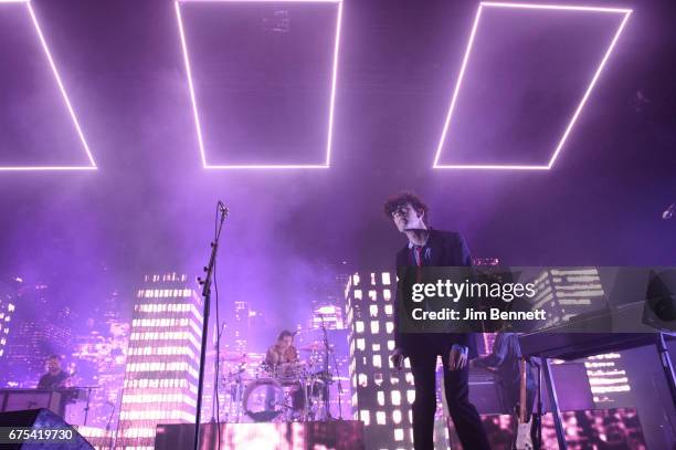 Drummer George Daniel, singer/guitarist Matthew "Matty" Healy and bassist Ross McDonald of 1975 perform live at WaMu Theater on April 30, 2017 in...